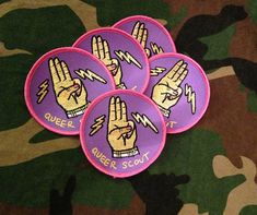 four purple patches with the words queen scout on them