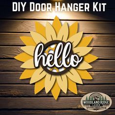 the diy door hanger kit has been made with wood and is ready to be hung