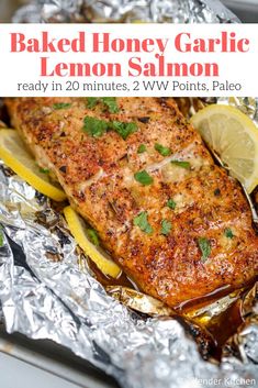 a piece of fish on foil with lemons and parsley