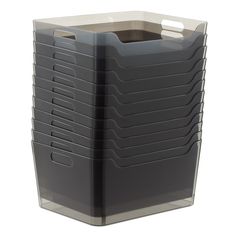 a stack of black plastic containers on a white background