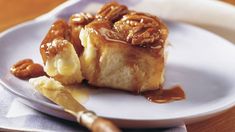 a white plate topped with cake covered in caramel