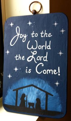 a hand painted sign that says, joy to the world the lord is come on it