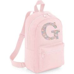 LIBERTY OF LONDON MINI PERSONALISED CHILDREN'S BACKPACK IN PINK A very handy little backpack - perfect for nursery, school, after school activities and weekends away. Featuring 2 zipped pockets and handle for carrying or hanging. Made from 100% polyester. The bag measures 35 x 23 x 12 cm with a capacity of 7 litres. Choose from any of The fabulous Liberty fabrics. Item can be cleaned by wiping with a damp cloth. | My Little Shop UK | Liberty Of London Personalised Mini Backpack, Pink | Maisonette collects the best children’s products from around the world (unlike Zulily, Etsy, The Tot, Farfetch Kids, Childrensalon, Crate and Kids, Kohls, Wayfair, Buy Buy Baby, Nordstroms, Mini Boden, J.Crew Factory, or PotteryBarn Kids), creating a curated shopping experience for you. Think of us as your s Pink Backpack For School Events, Cute Pink Backpack For School Events, Cute Pink School Backpack, Cute Pink Backpack For Back To School, Pink Backpack For Back To School, Pink Backpack For End Of School Year Events, Cute Pink Bags For School Events, After School Activities, Liberty Fabrics