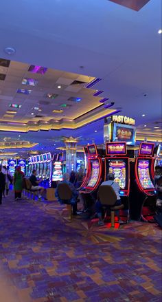 a casino room filled with lots of slot machines