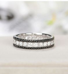 Welcome To RTK Jewels95 Item Description Type Ring Style Eternity Band Metal Sterling Silver Metal Purity 925 Parts Per 1000 Main Stone Diamond Main Stone Creation Simulated Diamond Color White and Black Diamond Shape Round Total Carat Weight 1.80 Ct Ring Size’s 5, 6, 7, 8, 9, 10, 11 and 12 All middle Size’s Available We offer Customization Want to add your personal touch? Contact us before ordering and we will create one just for you. Most customization requests include: 1) Redesign 2) Ring Resizing 3) We can make Engraving 4) Freshly made on order with quality and No old stocks 5) Customization-Yes 6) Engraving (Name or any message - no of characters subject to size of jewelry) ** Please send us a message on EBay for any customization request, we will get back to you. Customization may c Band Metal, Eternity Band Ring, Ring Style, Eternity Band, Diamond Color, Diamond Shape, Eternity Bands, Black Diamond, Band Ring