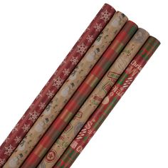 four wrapping paper rolls with christmas designs on them