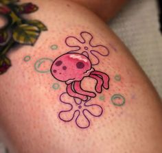 a close up of a person's legs with tattoos on them and an octopus