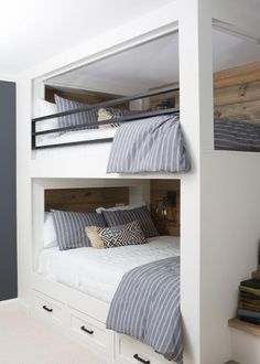 a bunk bed with two sets of drawers underneath it