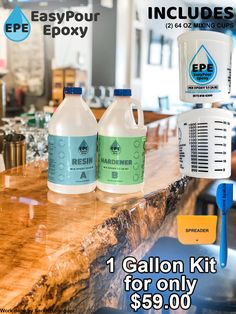 three gallon jugs of water sitting on top of a wooden counter next to each other