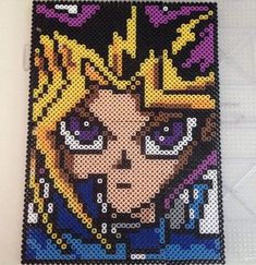 the pixel art is made with beads and plastic canvass to make it look like she's from sailor moon