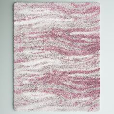 a pink and white rug on the floor