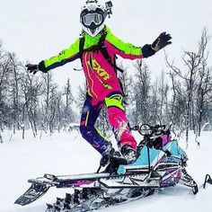 a person on a snowmobile in the snow