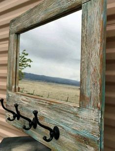 a mirror hanging on the side of a building