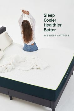 a woman sitting on top of a mattress