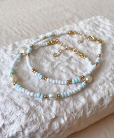 Pretty Seed Bead Bracelets, Coastal Beaded Bracelets, Ocean Theme Bracelet, Aesthetic Pearl Bracelet, Blue And Gold Bracelets, 6mm Bead Bracelet, Beaded Bracelets With Words, Blue And White Bracelet, Blue Pearl Bracelet