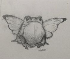 a drawing of a frog sitting on top of a piece of paper