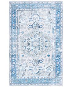 a blue and white rug with an ornate design on the bottom, in front of a white background