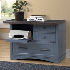 a desk with a printer on top of it