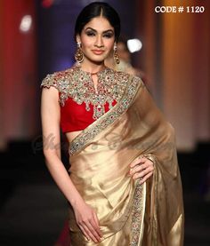 Featured is an eternal combination of golden and red which is presented in a form of bridal saree. The outfit is beautifully embellished with diamonds, zardosi and beads. Curated in tissue and silk, this ensemble will give you an amazing look We recommend this dress for ladies with banana shaped body. Color alteration, design conversion, additional border or embellishments are provided with an additional charge. Gold Anarkali Style Pre-draped Saree For Wedding, Red Saree With Mirror Work For Reception, Gold Pre-draped Saree With Zari Work For Weddings, Gold Saree With Dupatta For Reception, Designer Red Saree With Mirror Work, Gold Kundan Saree For Reception, Semi-stitched Gold Pre-draped Saree For Wedding, Gold Bollywood Pre-draped Saree With Cutdana, Gold Bollywood Pre-draped Saree With Pallu