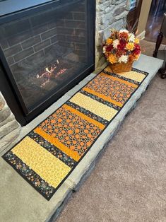 a fireplace with a fire place mat next to it