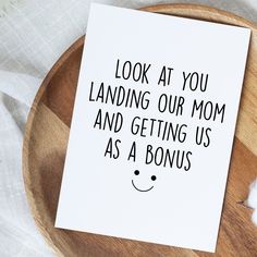 a card that reads, look at you landing our mom and getting us as a bonus