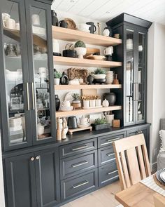 a dining room hutch filled with lots of dishes