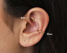 a woman's ear is shown with measurements