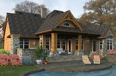 this is an artist's rendering of a house with a pool in the front yard