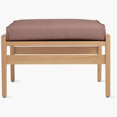 a wooden bench with a cushion on it