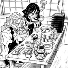 two people sitting at a table eating food