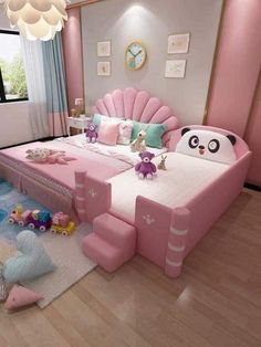 a bedroom with pink furniture and lots of toys