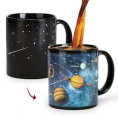 two coffee mugs with the outer planets painted on them and an arrow pointing to each other