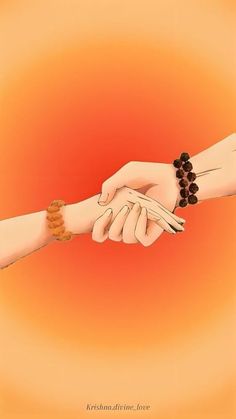 two hands holding each other with beads on them