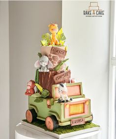 there is a cake made to look like a truck with animals on it