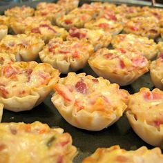 some food that is sitting on a baking sheet and ready to be baked in the oven