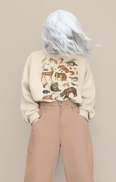 Woodland Animals Sweater, Retro Forestcore Fox Raccoon Academia Sweatshirt, Outdoors Mountains National Parks Shirt, Nature Lover Gift DETAILS ♥ Looking for a stylish and comfortable sweatshirt that celebrates nature's beauty? Our vintage design with woodland animals sweatshirt is the perfect choice! Featuring a classic design with adorable woodland creatures and made with soft and durable materials, this sweatshirt is perfect for any casual occasion. Whether you're hiking in the woods or lounging at home, you'll love the warmth and style of our vintage woodland animals sweatshirt. Order yours today and enjoy the perfect combination of comfort and nature-inspired fashion! ♥ This woodland animals design is printed on a soft Unisex Heavy Blend Gildan Crewneck Sweatshirt ♥ 50% Cotton and 50% Cottagecore Hoodie, Fairycore Light, Witchy Sweater, Light Academia Cottagecore, Goblincore Clothes, Crewneck Sweatshirt Outfit, Witchy Grunge, Cottagecore Sweater, Sweater Details