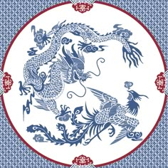 a blue and white plate with two dragon on it