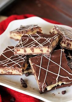 chocolate and peanut butter squares on a white plate