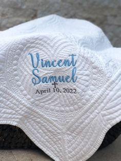 a close up of a white towel on top of a black shoe with the word innocent samuel printed on it