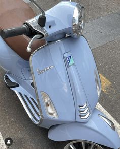 a blue scooter is parked on the street