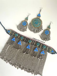 Afghan vintage light blue 3 piece kuchi jewellery set,kuchi necklace,  Afghan jewellery, Afghan Fashion,  Set includes:  -1 pair of oversized earrings  -1 necklace  -1 tikka  Message for any inquiries Our Aim as a business is to connect Afghan women with their roots and to make anyone that purchases our jewellery feel powerful and beautiful as each and everyone of our items is handcrafted with care and love. Blue Latkans Jewelry For Festival, Blue Vintage Jewelry For Festivals, Vintage Blue Jewelry For Festivals, Bohemian Blue Metal Jewelry Sets, Turquoise Bohemian Metal Jewelry Sets, Vintage Metal Jewelry Sets For Festival, Bohemian Jewelry Sets For Festivals, Kuchi Jewelry, Afghan Wedding