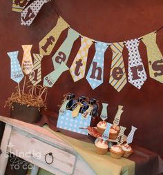 a table topped with lots of cupcakes and cake