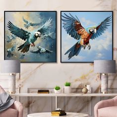 two paintings of parrots flying in the sky above a table with chairs and lamps