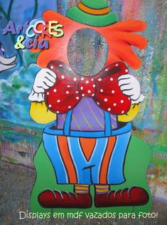 a painting of a clown wearing a red bow tie