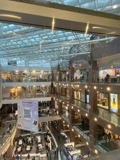 the inside of an airport with people walking around