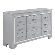 a white dresser with many drawers on it