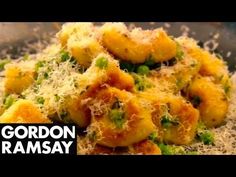 a close up of food in a bowl with grated parmesan cheese on top