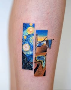 an artistic tattoo on the leg of a woman's legs with paintings painted on it