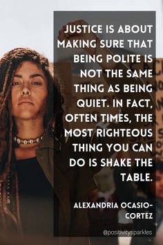 a woman with dreadlocks standing in front of a sign that says justice is about making sure that being polite is not the same thing as being quiet