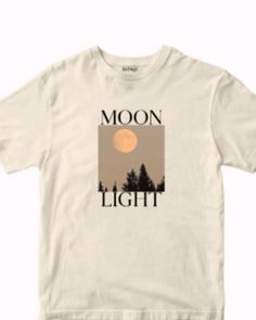 a white t - shirt with the words moon light on it and trees in the background